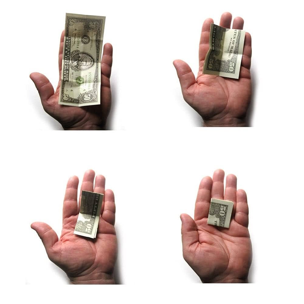Close-up of fingers folding a dollar bill