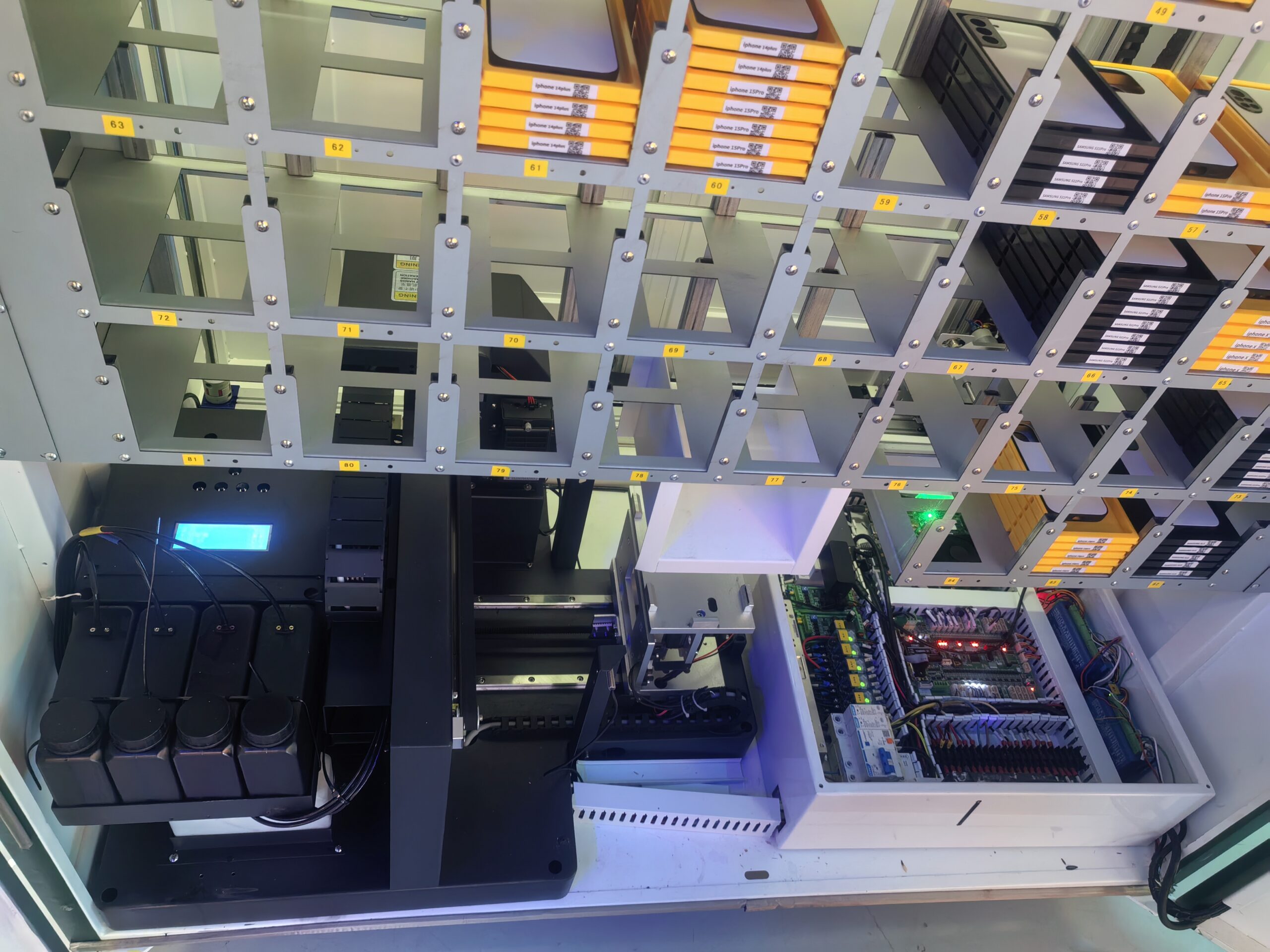 A PrintYOLO machine next to a busy escalator in a mall, capturing high foot traffic.